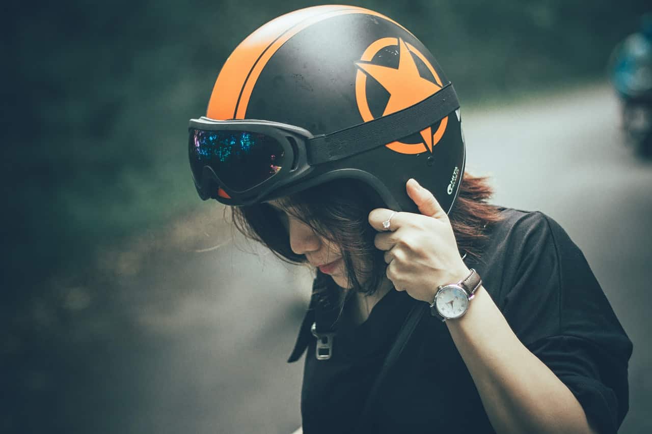 woman wearing an open face motorcycle helmet