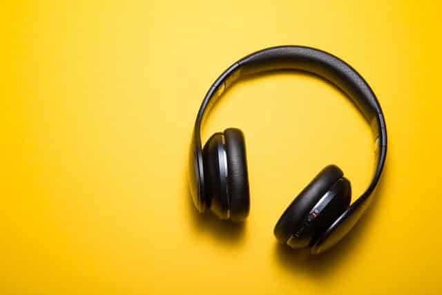 black music headphones yellow background